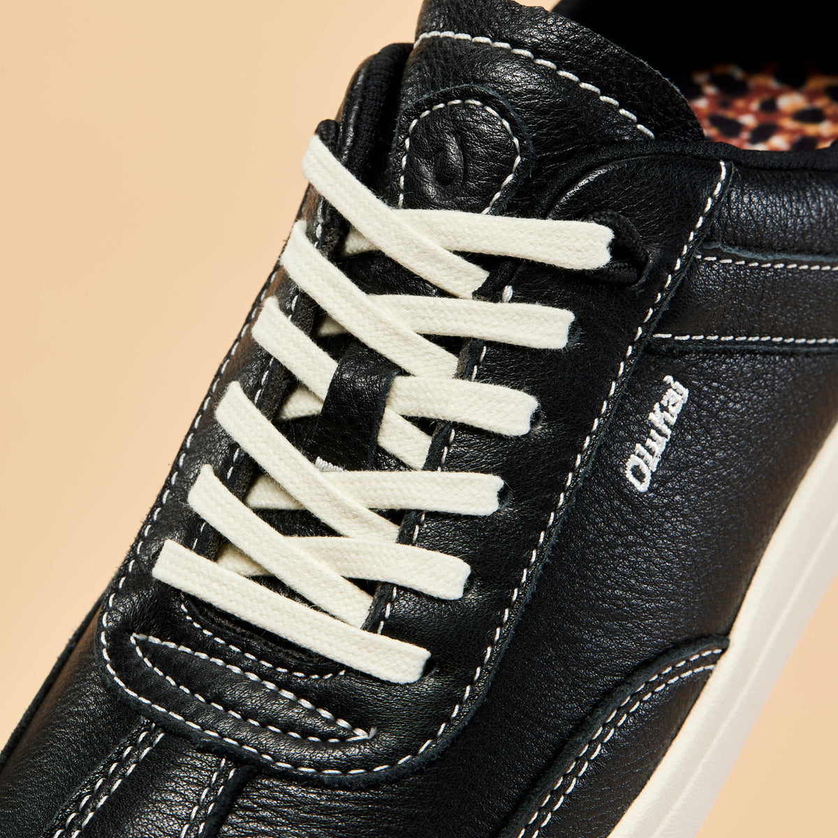 OluKai Women | Hā‘upu Women’s Leather Sneakers - Onyx